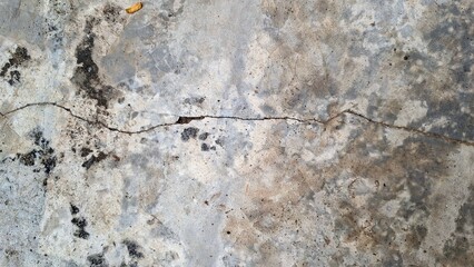 Grunge concrete texture with distressed weathered stone surface, aged wall background with rough cement patterns and abstract industrial texture design element