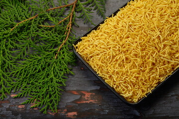 Homemade crispy fried sev - traditional sack food from India.