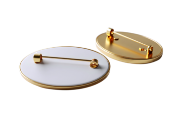 Two blank oval golden brooches with pin backs isolated on transparent background