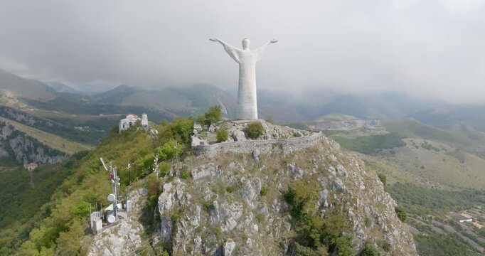 Aerial view of the statue of San Biagio atop a mountain near Maratea, in the province of Potenza, Basilicata, Italy. It is often called the Christ of Maratea, but represents the town's patron saint.