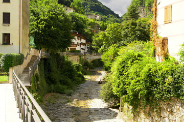 A path along a stream in Valstagna, Veneto, Italy