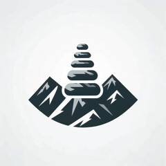 zen stones balanced on mountain peak.