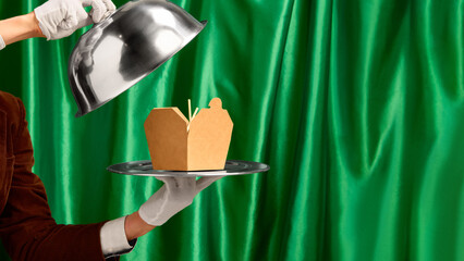 Blank food delivery box on silver tray revealed by waiter hand in white glove. Concept of luxury branding, fine dining adaptation, restaurant marketing, and modern catering services.