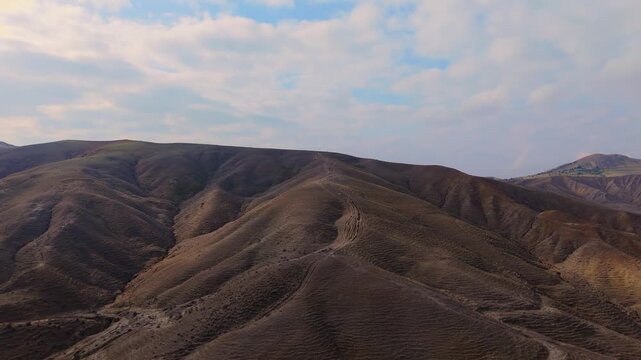Aerial ascending view of Calanchi del Cannizzola (or Deserto dei Calanchi), known as the &ldquo;Sicilian desert&rdquo;, a series of clay formations in East Sicily