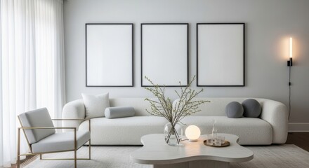 Modern living room with a textured boucle sofa, armchair, and three blank frames on a light gray wall, bathed in natural light