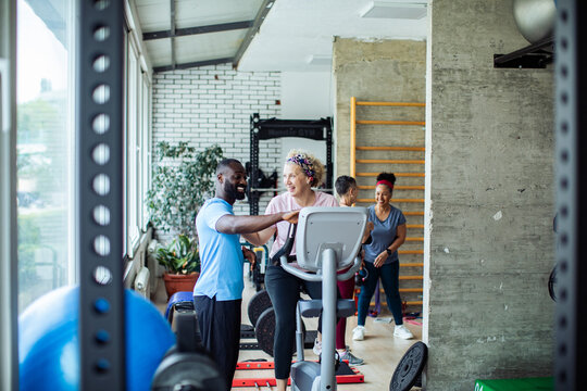 Group of people exercising in gym