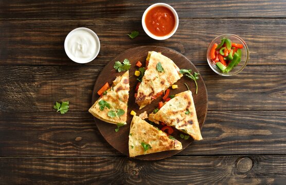 Chicken quesadilla with fresh vegetables, top view