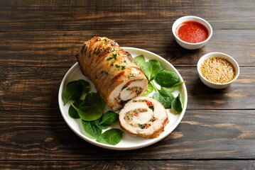 Roasted pork roll stuffed with mushroooms, onion, red bell pepper, spinach