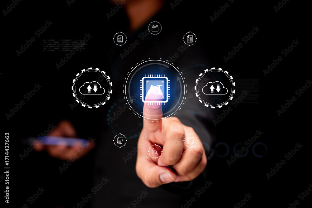 Fototapete a person interacts with a digital interface displaying technology-related icons and data, highlighti