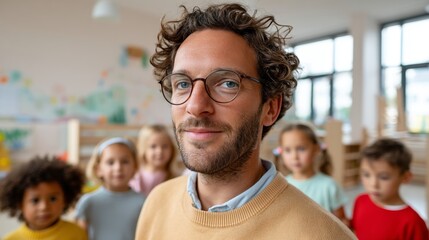 Man standing in front of children in a classroom.