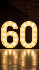 Illuminated numbers sixty on a reflective surface