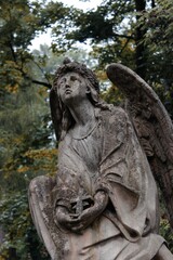 Ancient stone angel holding a bowl