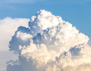 Fluffy white cumulus clouds against a clear blue sky