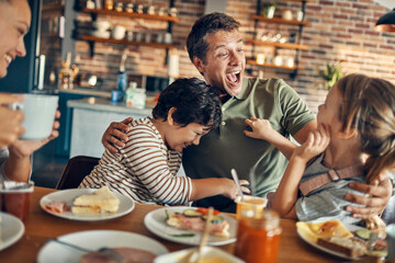 Family enjoying breakfast together