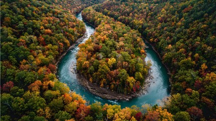 A winding river through a forest in peak fall color