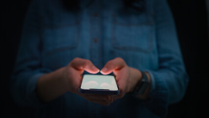 Close Up Of Woman Using Mobile Phone Text Messaging Using Thumbs On Keypad