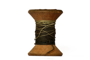 Antique wooden spool with thread rustic sewing concept