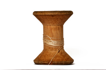Antique wooden spool with thread rustic sewing concept