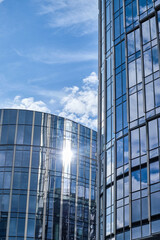 The beautiful mirrored skyscrapers of Warsaw against a backdrop of blue sky and white clouds