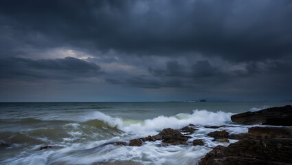 Dramatic Coastal Seascape: Dark Storm Clouds over Ocean Waves Crashing on Rocky Shore