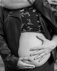 pregnant woman holding her belly