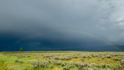 Faint Rainbow Crosses The Fields Below Grand Teton