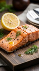 A delectable piece of cooked salmon, seasoned with herbs and spices, sits on a wooden cutting board, accompanied by a slice of lemon.
