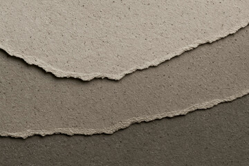 Layered torn recycled paper texture in neutral greys