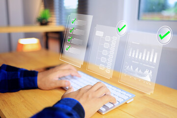 document management concept with hand typing keyboard to working on office desktop via virtual screen info graphic to check working status in digital file represent paperless system implementation