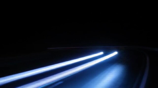 Capturing motion: abstract light trails from cars at night on the road