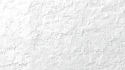 A close-up, textured view of a rough, white-painted stone wall, showing the uneven surfaces and shadows.