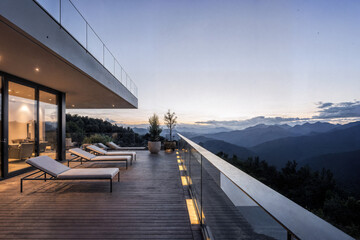 Modern Patio with Minimalist Lounge Chairs and Panoramic Mountain View