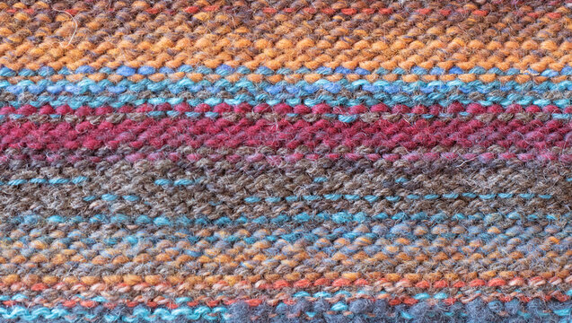 a knitted pattern of different woolen threads