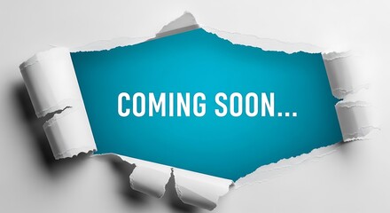 Torn paper revealing blue background with text white paper