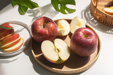 Red apple slices isolated on white background.