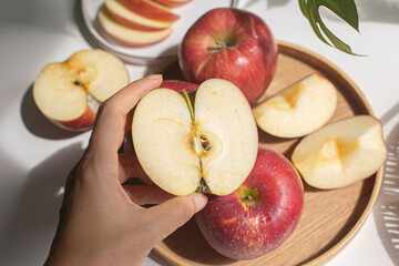 Red apple slices isolated on white background.