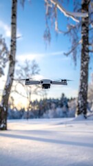 Drone flying over snowy forest