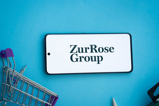 Dhaka, Bangladesh- 03 July 2025: Smartphone displaying Zur Rose Group logo with shopping cart on a blue background.
