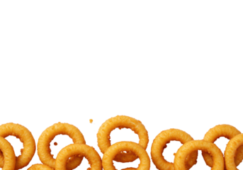 Golden-brown onion rings with crispy light batter texture, artfully arranged on a transparent background with ample copy space, high-key studio lighting. Concept for fast food advertising