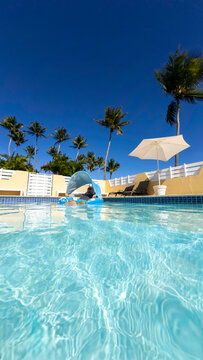 Man floating in a pool 
