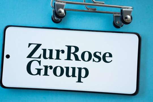 Dhaka, Bangladesh- 03 July 2025: Smartphone screen showing the Zur Rose Group logo with shopping cart wheels on a blue background.