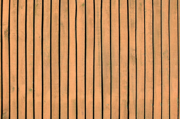 Fototapeta premium New brown weathered and distressed modern wood timber board fencing planks background, fence backdrop stock photo image