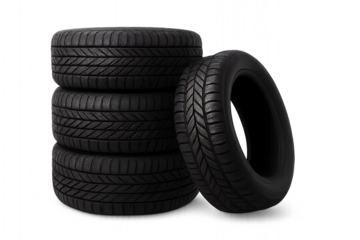 Stack of car tires with one tire leaning against it isolated on transparent background