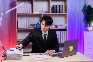 Young executive analyzing data with determination to boost business success.