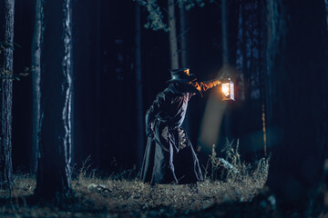 Mysterious figure illuminates dark forest with antique lantern.