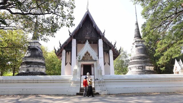 Footage of Couple Appreciating Wat Thammaram Medieval Buddhist Temple from the Outside, Ayutthaya Historical Park, Thailand