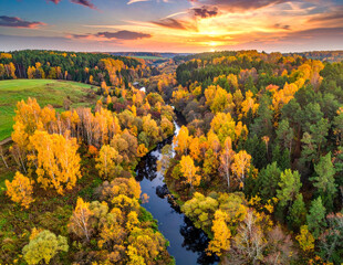 Breathtaking aerial view of autumn forest and winding river