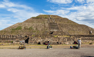 Teotihuacan, Mexico - 1 December 2022: Tourists and pyramid of the Sun of Teotihuacan