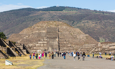 Teotihuacan, Mexico - 1 December 2022: Tourists and pyramid of the Sun of Teotihuacan