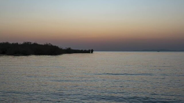 Lake Victoria golden sunset, where the sun dips into calm waters under a glowing sky. Taken at Speke Bay, Kenya.